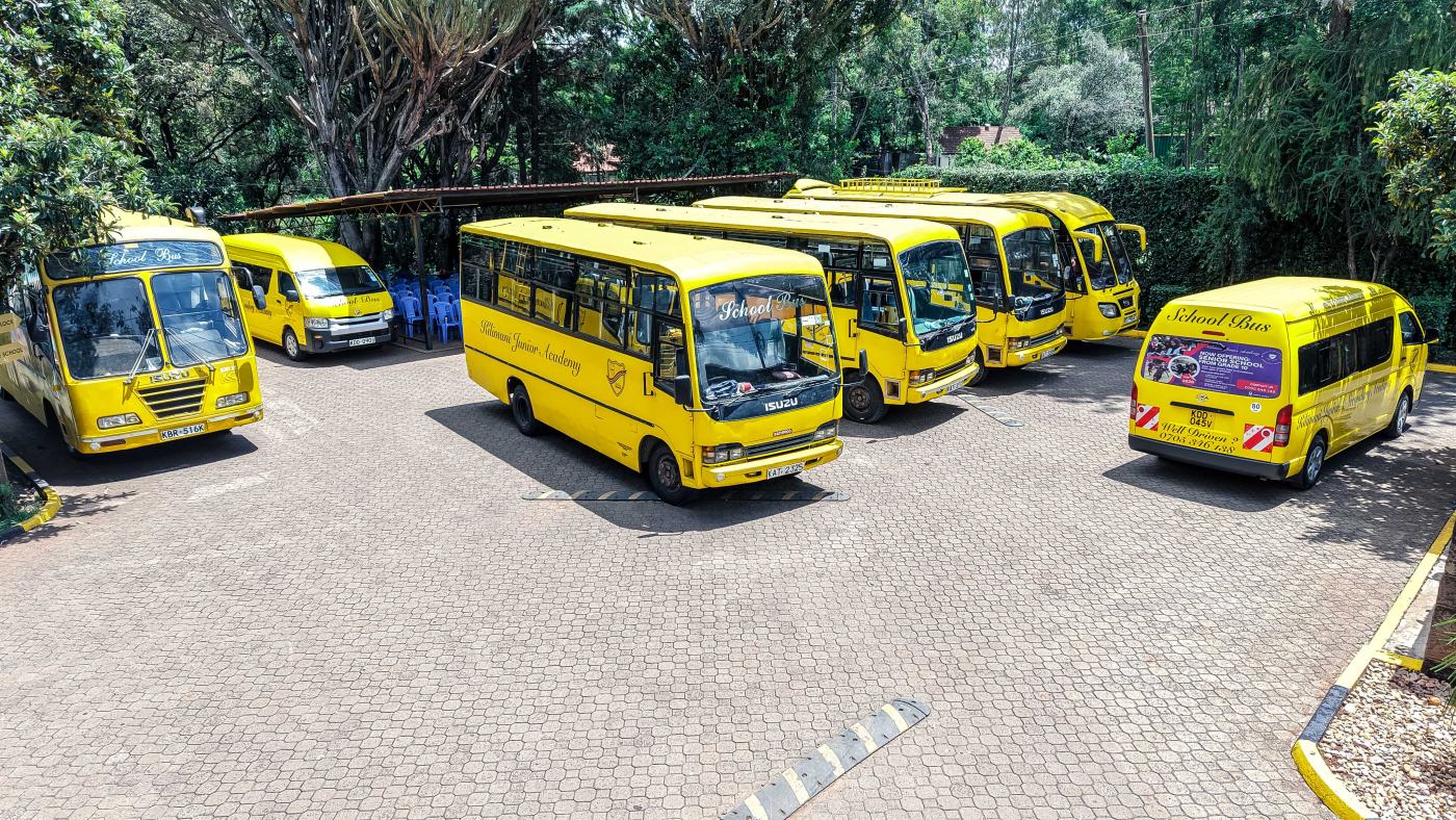 Aerial view of the Kilimani Junior & Senior Academy campus and school buses